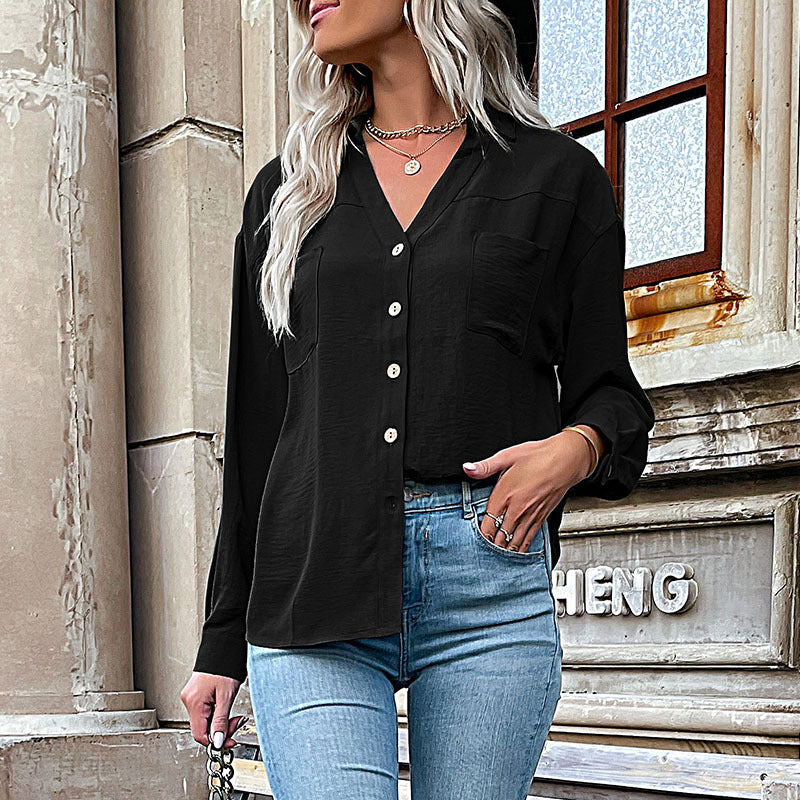 Women's blouse with a relaxed fit and decorative button details, size [size missing]