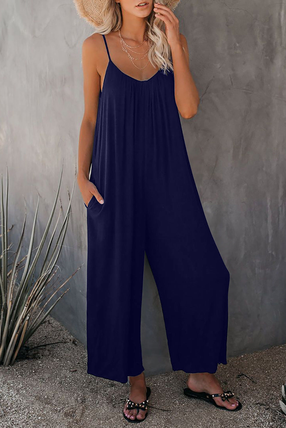 Women's casual jumpsuit with decorative straps and light, flowing fabric, size S