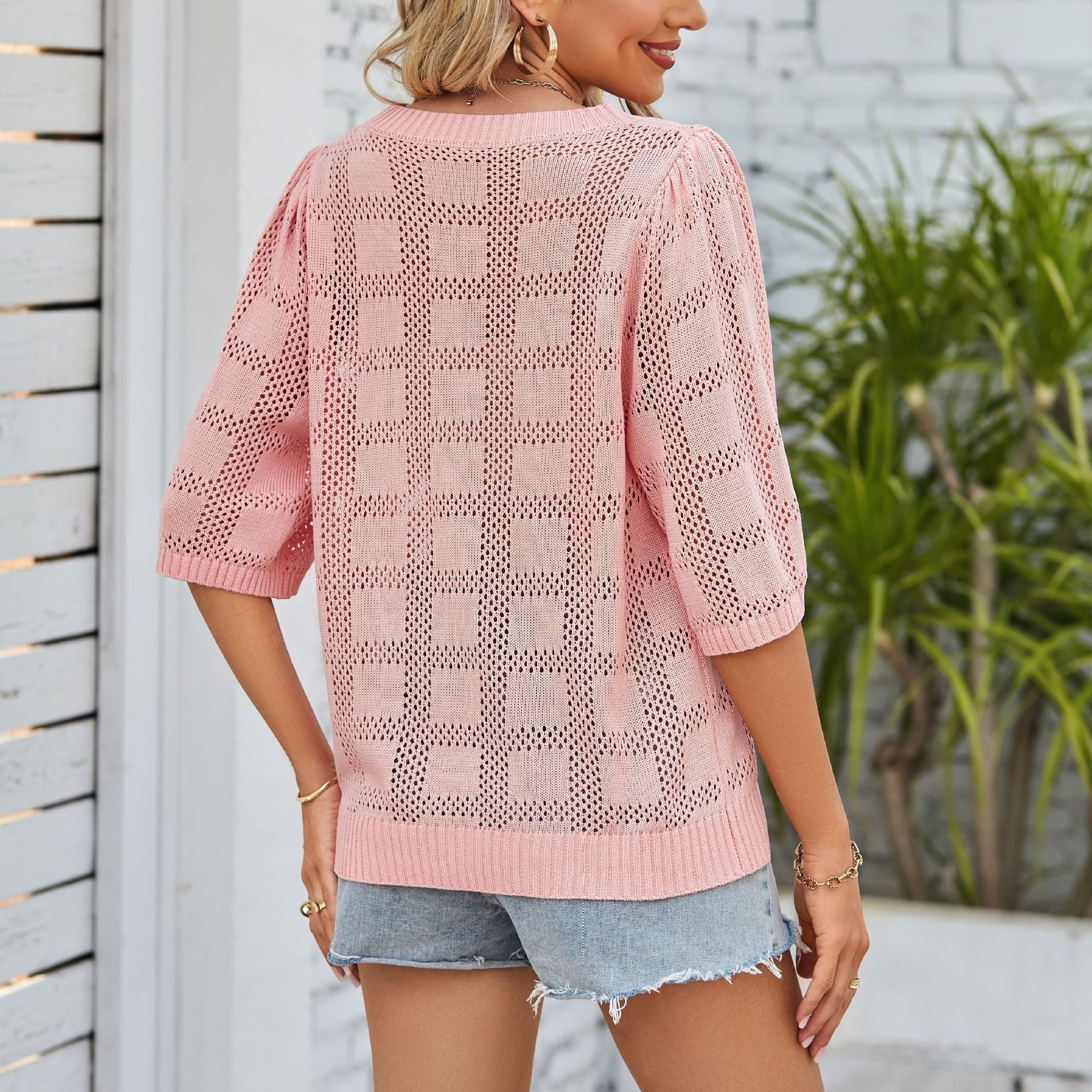 Women's airy knit top with a loose fit and modern openwork pattern, size