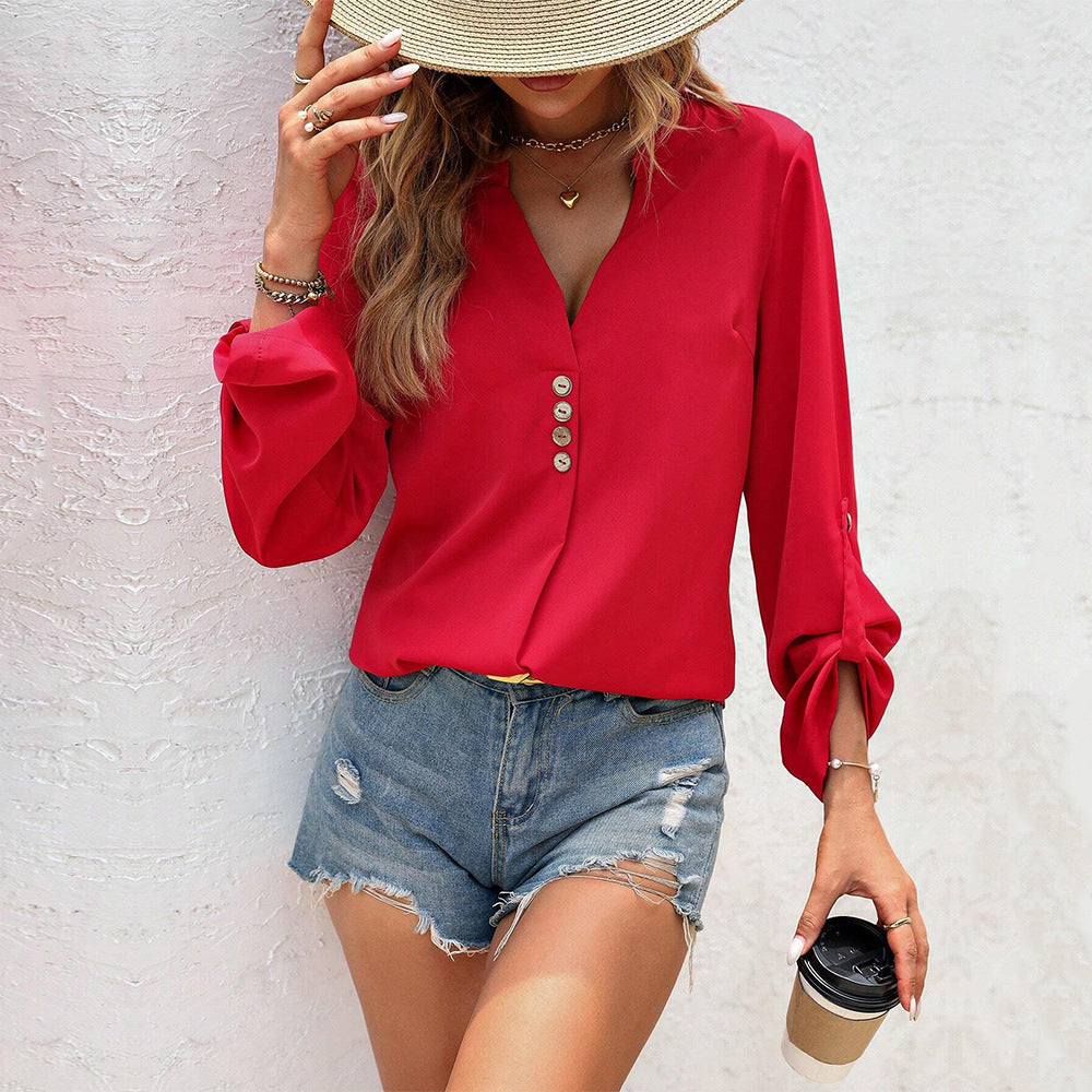 Women's blouse with elegant V-neck and refined button details, size