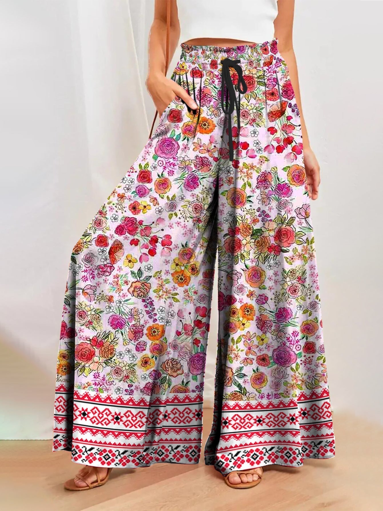Women's wide-leg floral trousers with elasticated waistband and practical pockets, size