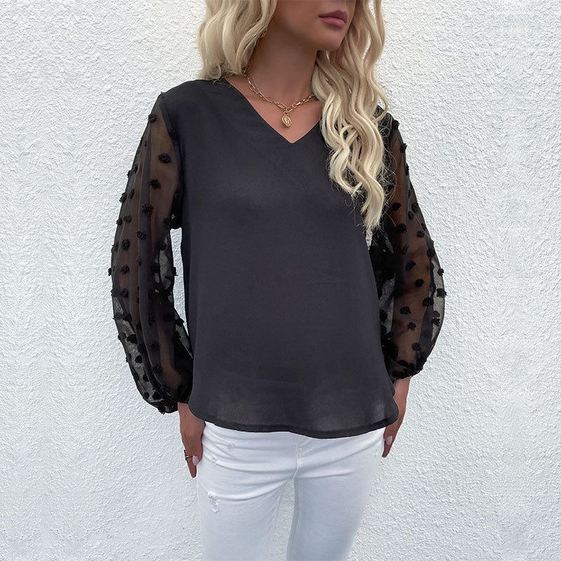 Women's blouse with elegant puff sleeves and textured outer material, size S