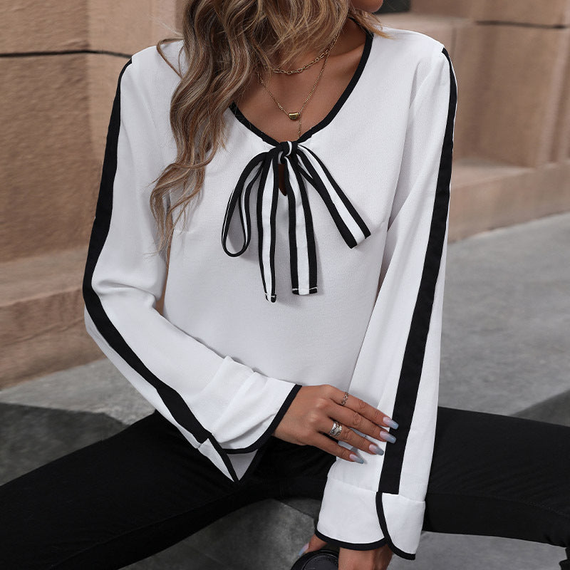 Women's blouse with decorative bow collar and contrasting sleeve cuffs, size [size missing]