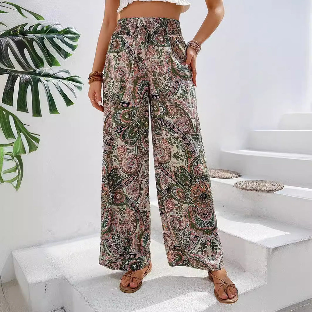 Women's wide-leg palazzo trousers with elasticated waistband and elegant paisley pattern, size S