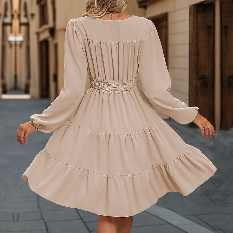 Women's knee-length wrap dress with ruffles and button details, size
