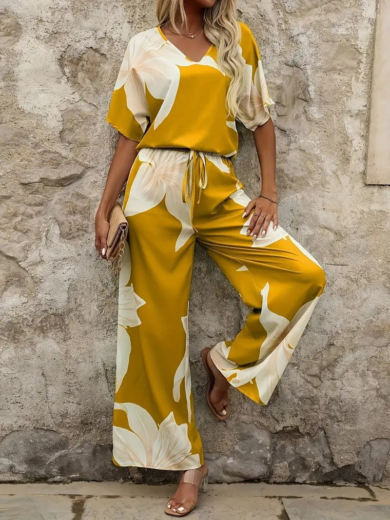 Women's relaxed jumpsuit with floral design and elasticated waistband, size
