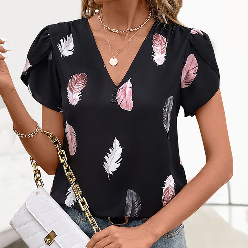 Women's blouse with romantic feather pattern and puff sleeves, size