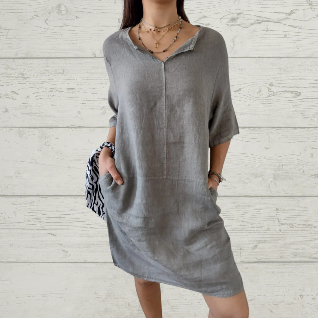 Women's lightweight linen dress with front button detail and side pockets, size