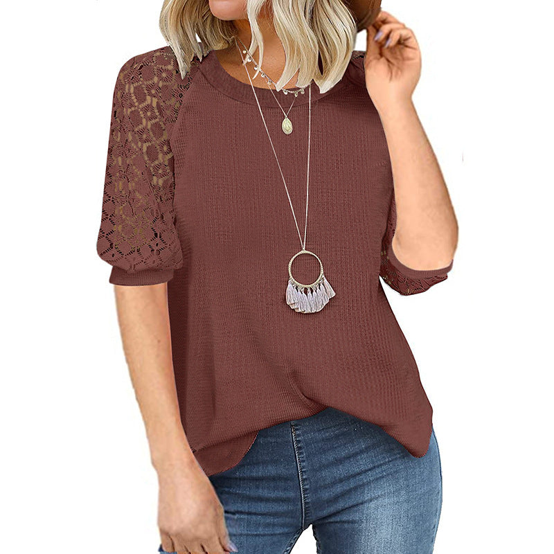 Women's top with lace sleeves and textured fabric, size