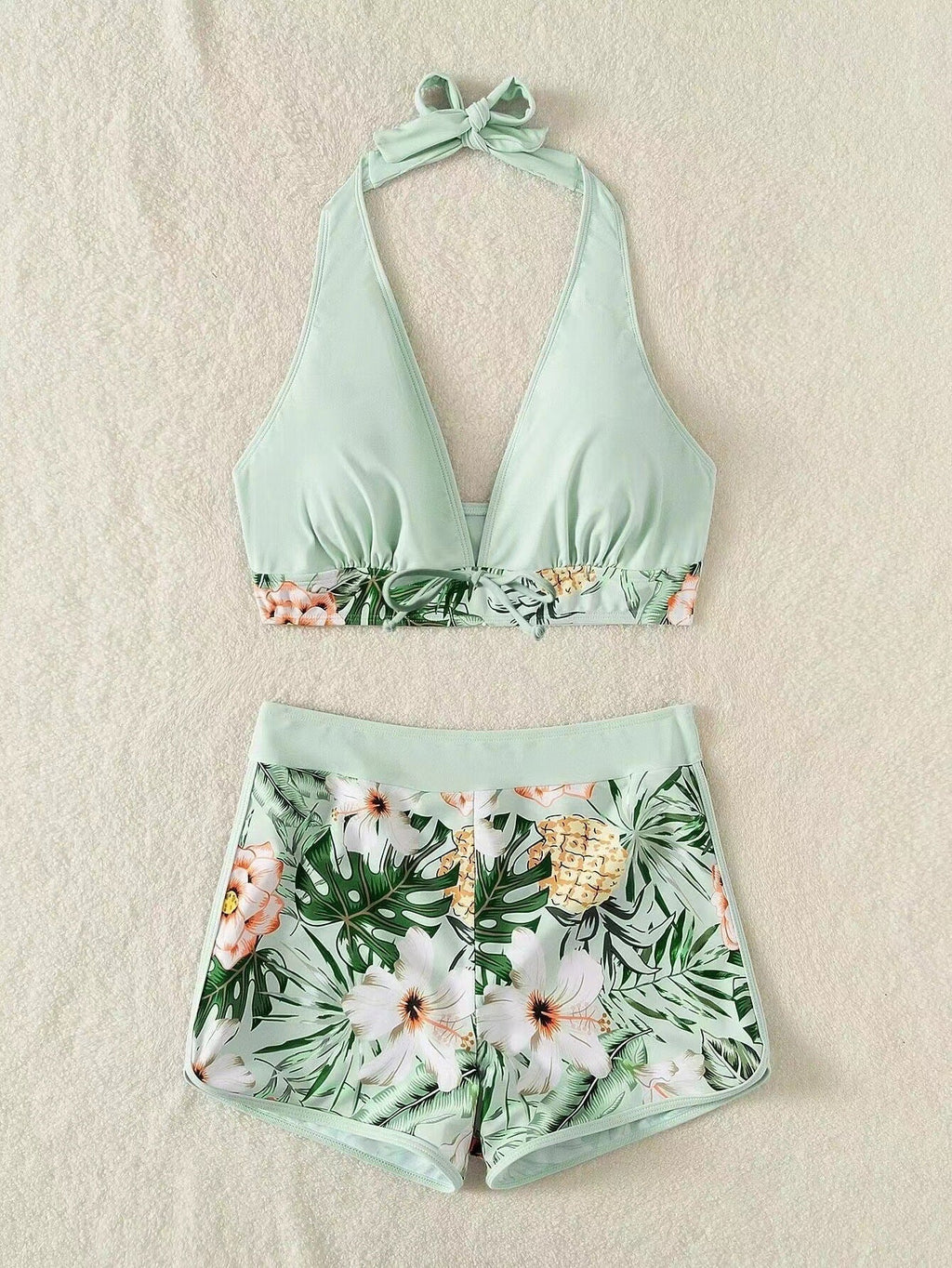 Women's sporty bikini set with woven top and patterned shorts, size [size]