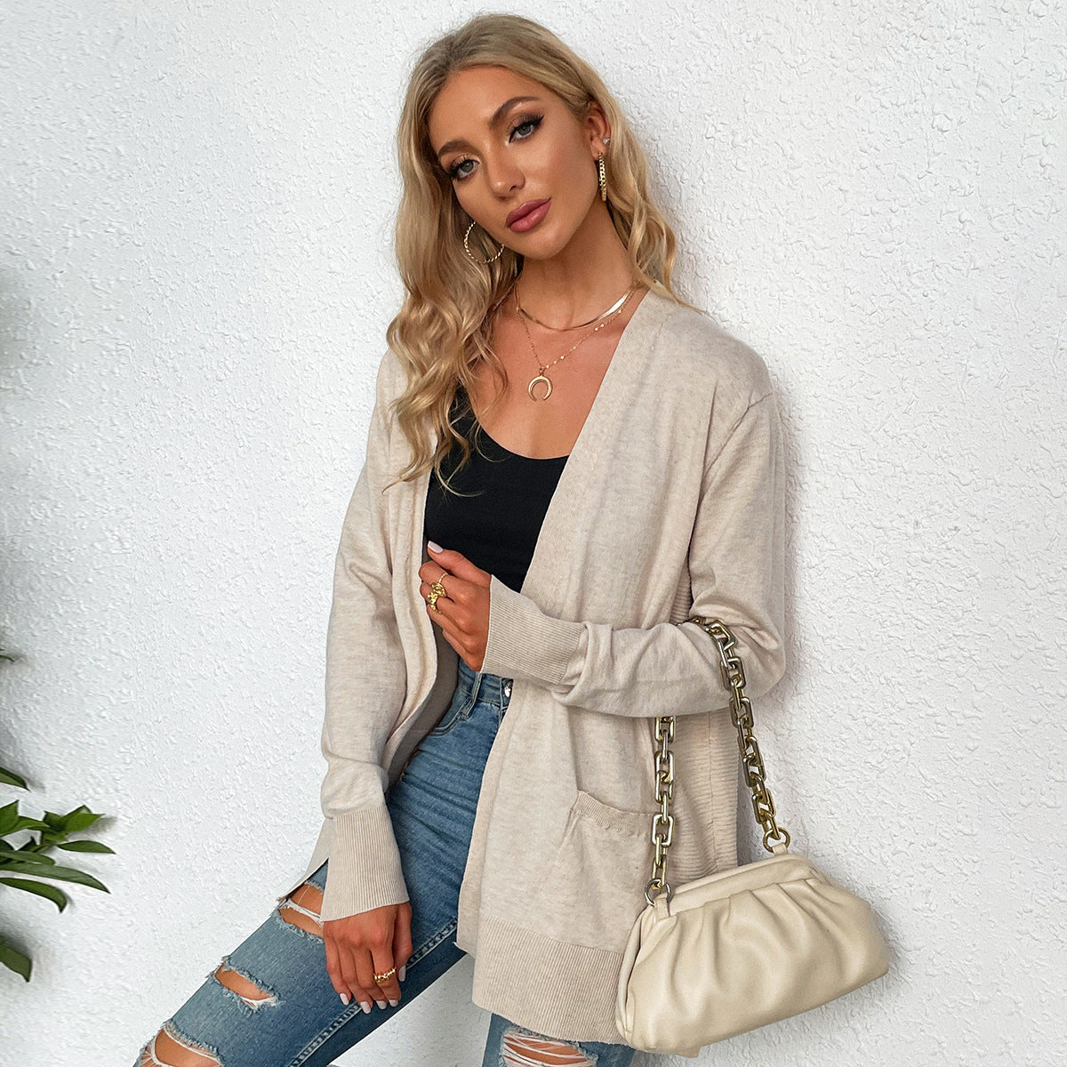 Women's casual knit cardigan with deep V-neck and practical pockets, size S