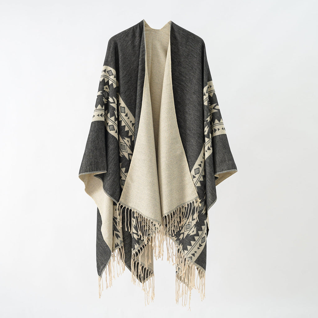 Women's elegant knitted poncho with artistic fringe and floral accents Valenzora