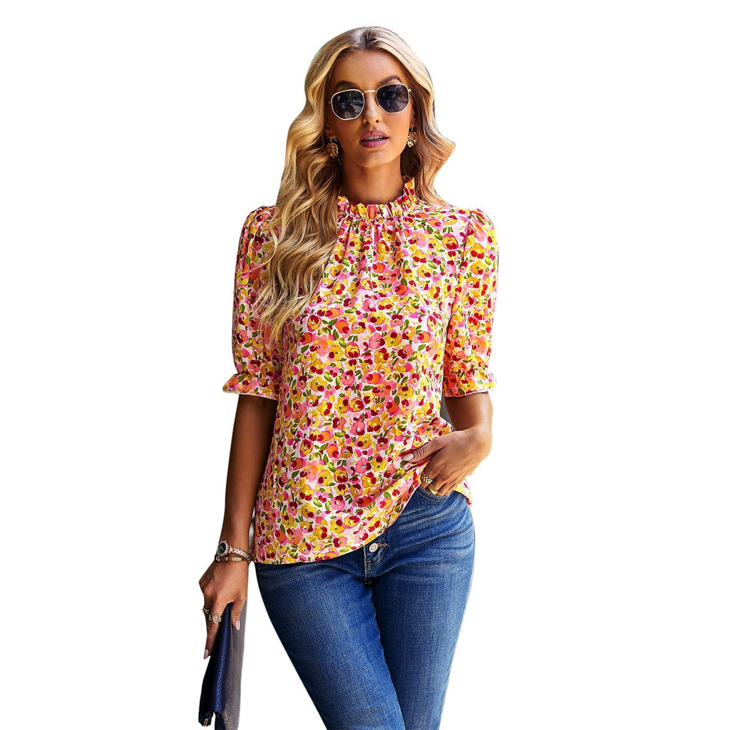Women's blouse with playful floral design and puff sleeves, size