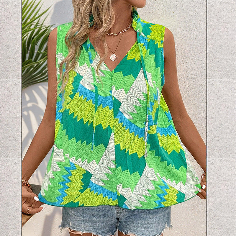 Women's sleeveless blouse with a modern knot design and vibrant pattern, size S