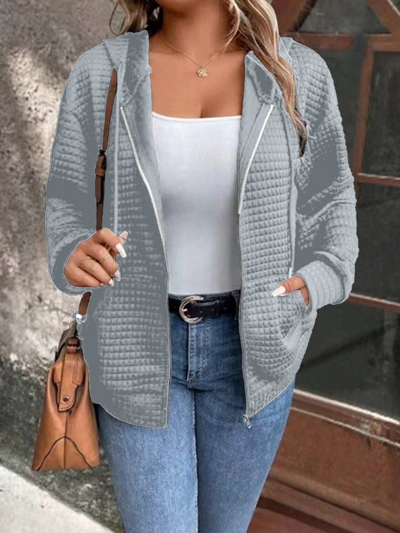 Women's loose-fitting hooded jacket with a textured waffle surface and practical pockets, size S