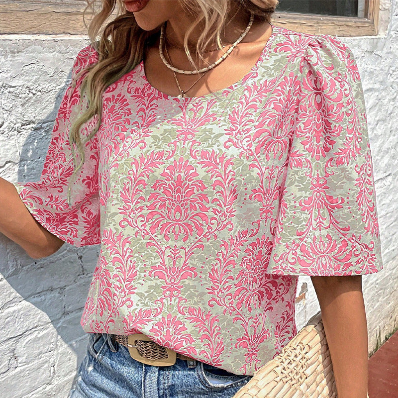 Women's blouse with voluminous sleeves and floral patterns, size