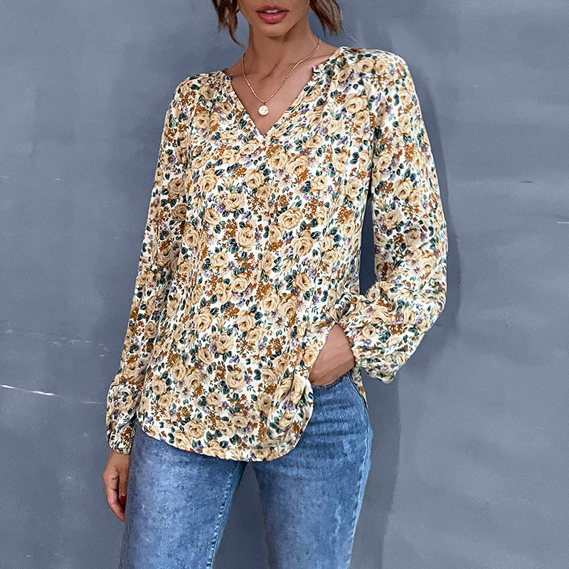 Women's blouse with floral design and elegant puff sleeves, size