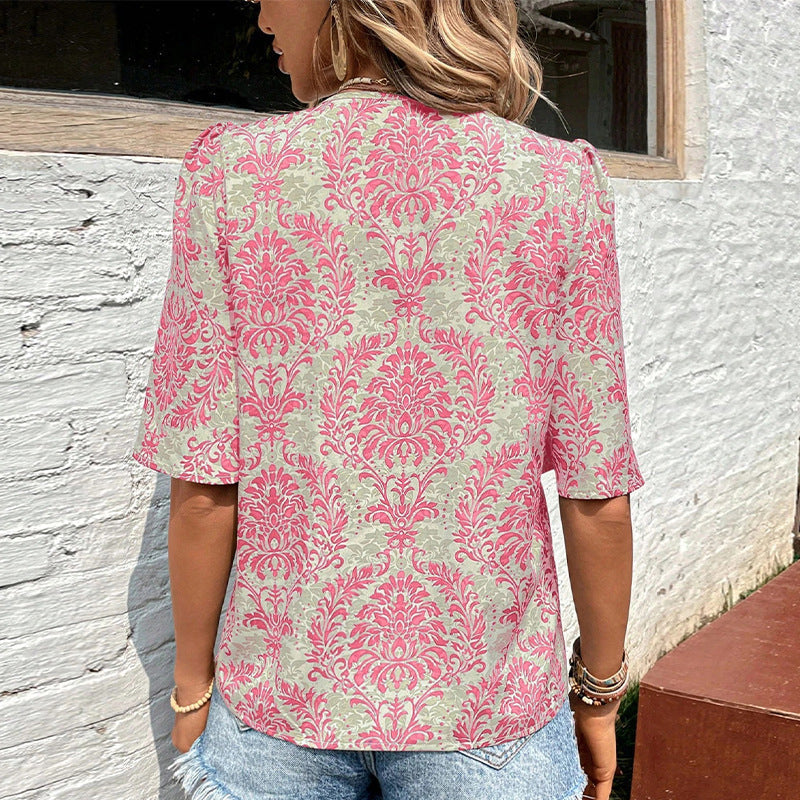 Women's blouse with voluminous sleeves and floral patterns, size