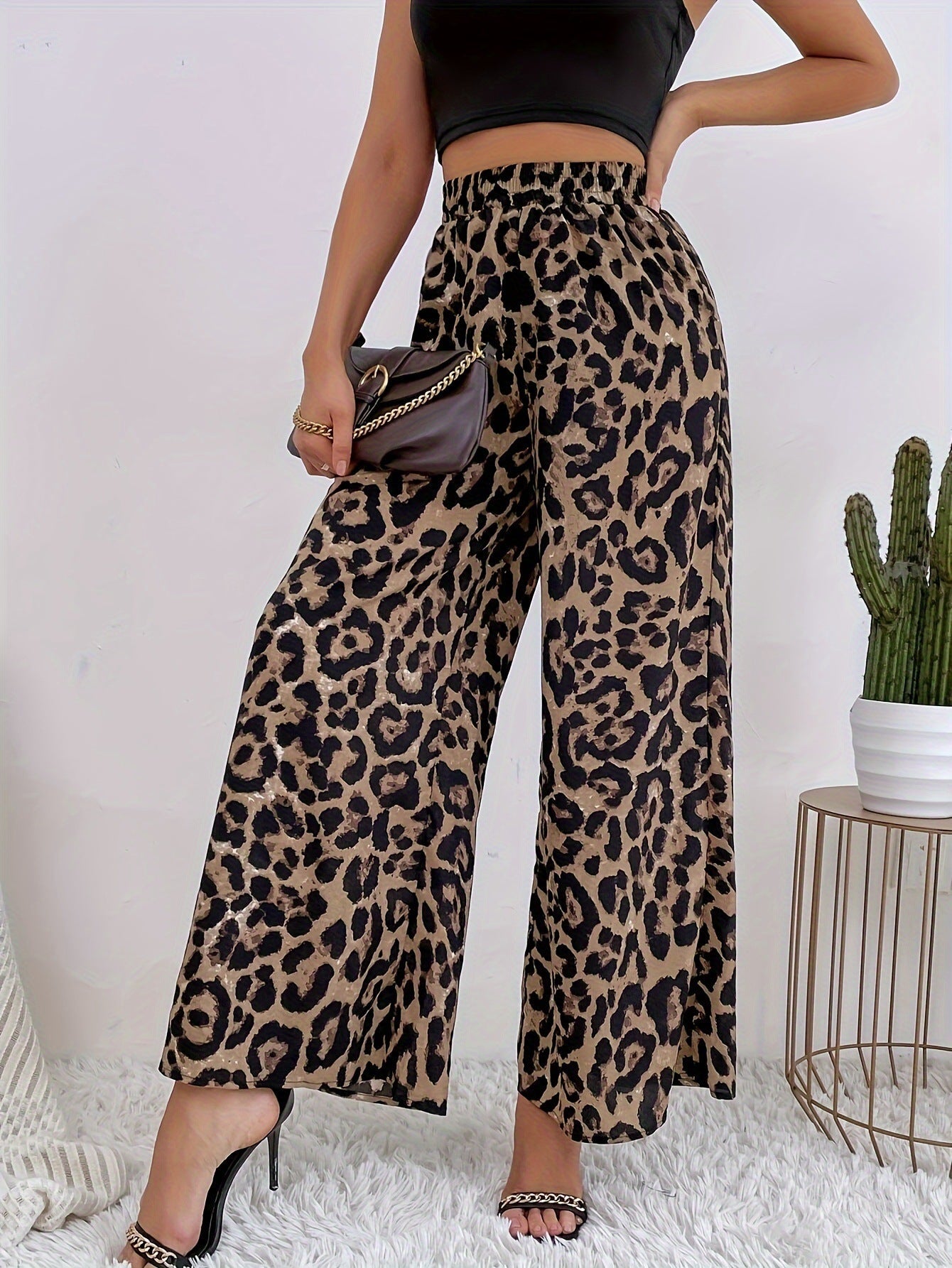 Women's wide-leg leopard print trousers in flowing material with elasticated waistband, size S