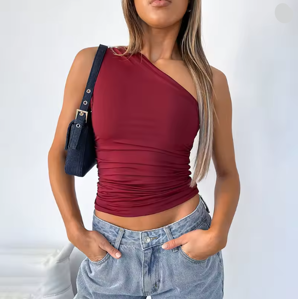 Women's asymmetrical crop top with figure-flattering design, size