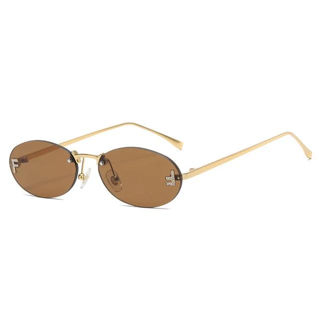 Valenzora | Oval sunglasses with golden accents and subtle stones