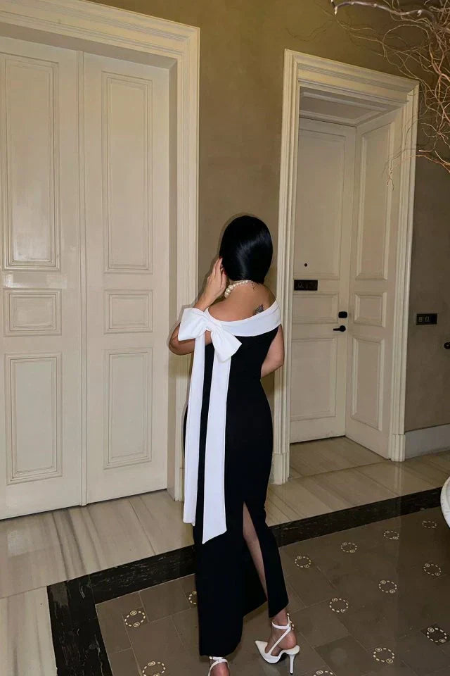 Valenzora | Elegant off-shoulder midi dress in black with white bow detail