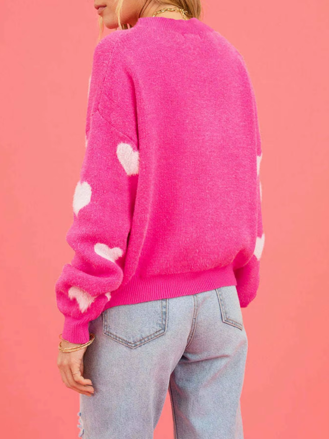 – Knitted sweater with heart print